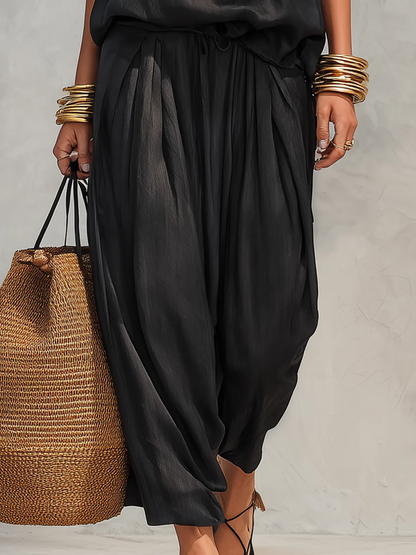 IBONE | Ensemble noir avec top sans manches à col halter et pantalon plissé