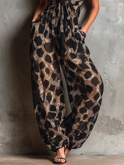 Roberta · Combinaison ample en mousseline noire à imprimé animal, col halter et pantalon palazzo