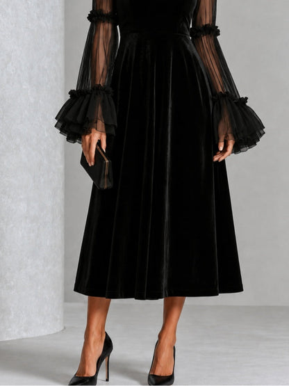 Stefania | Robe midi plissée en velours noir et tulle transparent